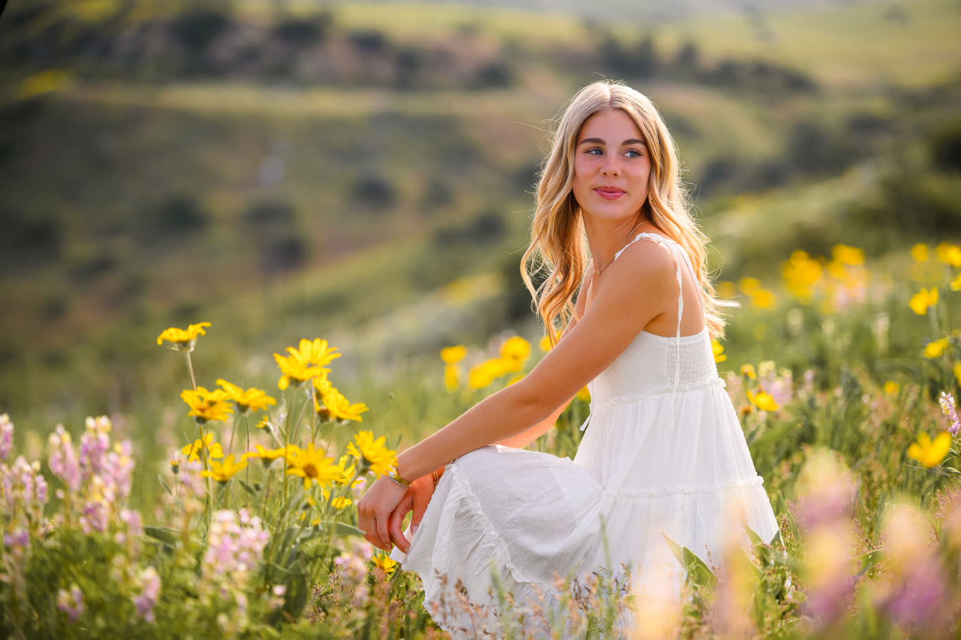 Boise senior portrait session in a Southern Idaho wildflower field at golden hour
